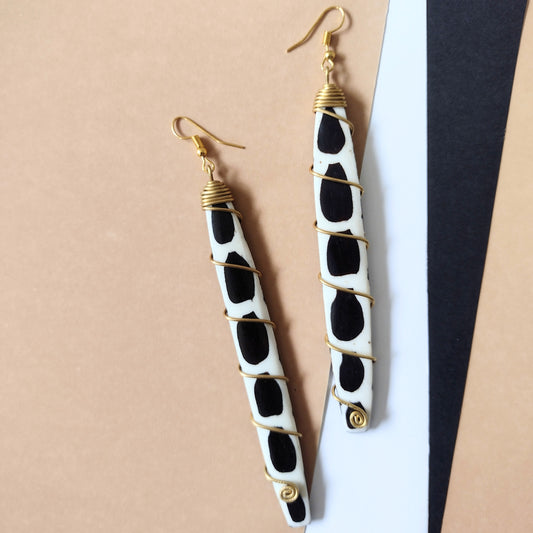 Afrocentric 4inch long earrings with white and black detail in brass wire wrapping 